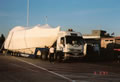 shrink wrapped cargo on a low loader