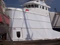 Shrink wrapped ship for repair with access door